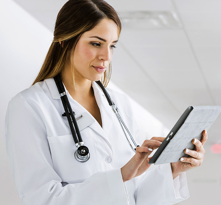 Oakhurst Medical Center healthcare worker on a tablet.