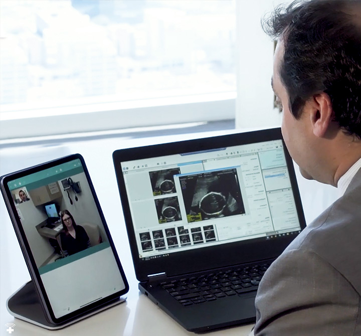 Man speaking to a physician through a tablet 