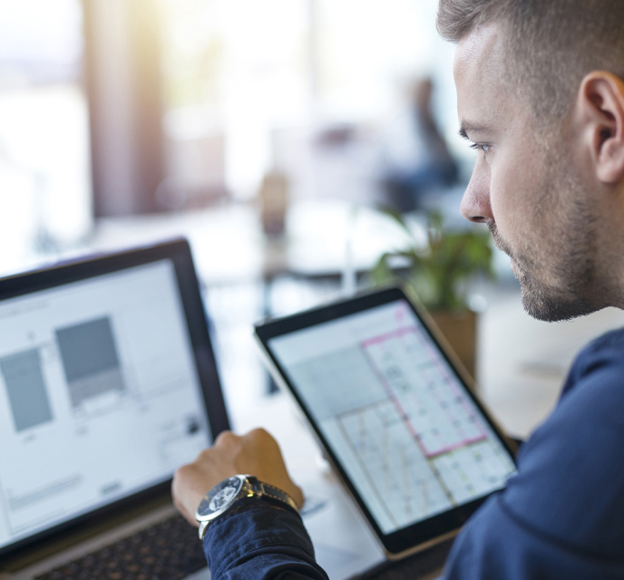 Man on laptop looking at screen.