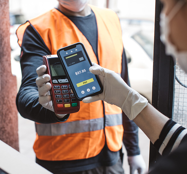 Person using mobile phone to pay for service