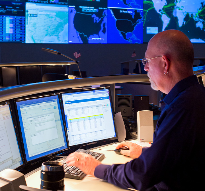 Man working at a computer in the GNOC