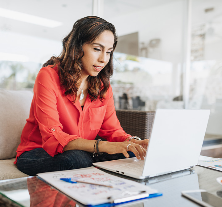Woman working on laptop at home