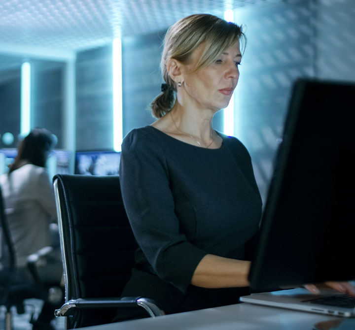 Woman working on computer in office.
