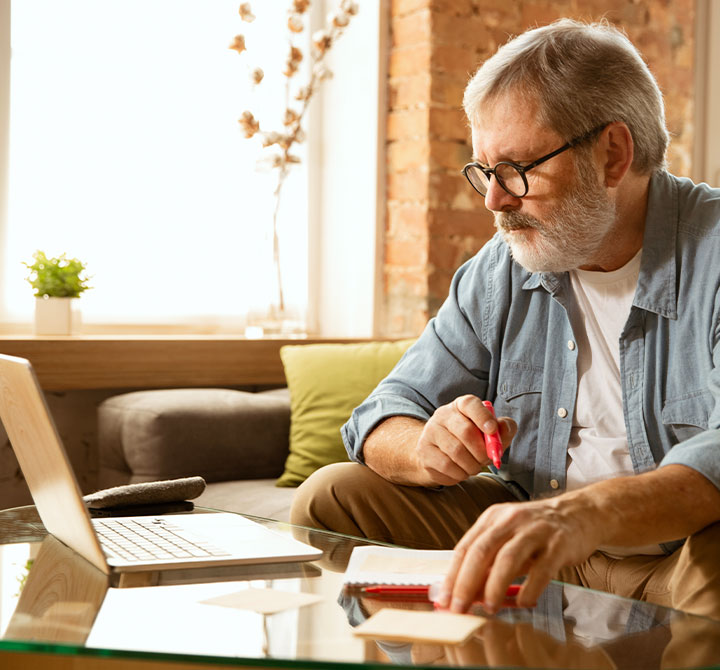 Man working from home on laptop.