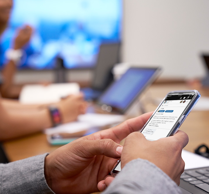 UHL employee using smart phone. 