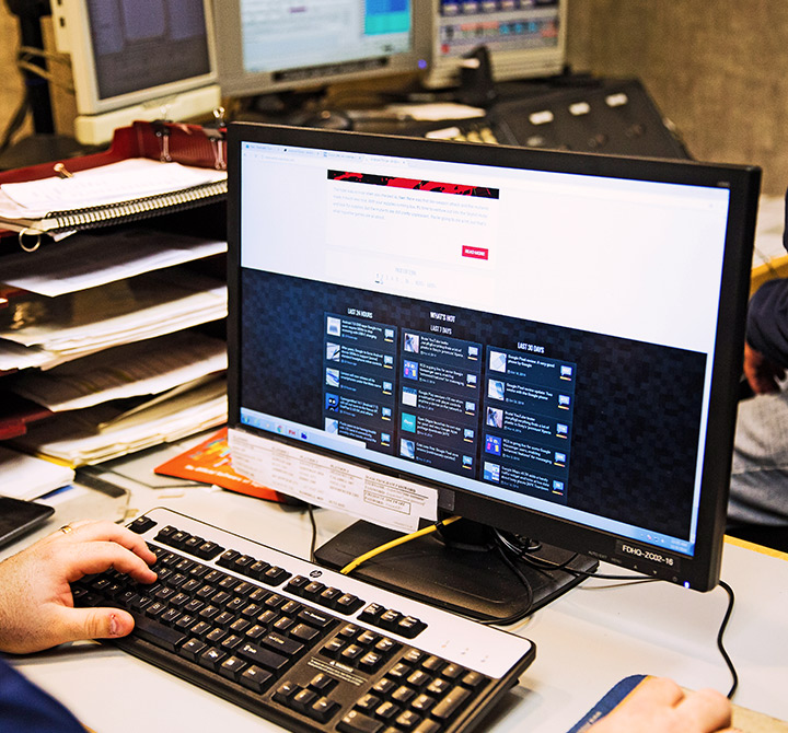 Close up view of a man using a computer.