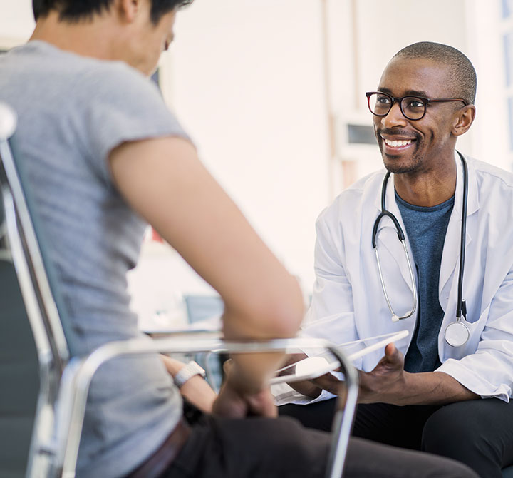 man talking to doctor