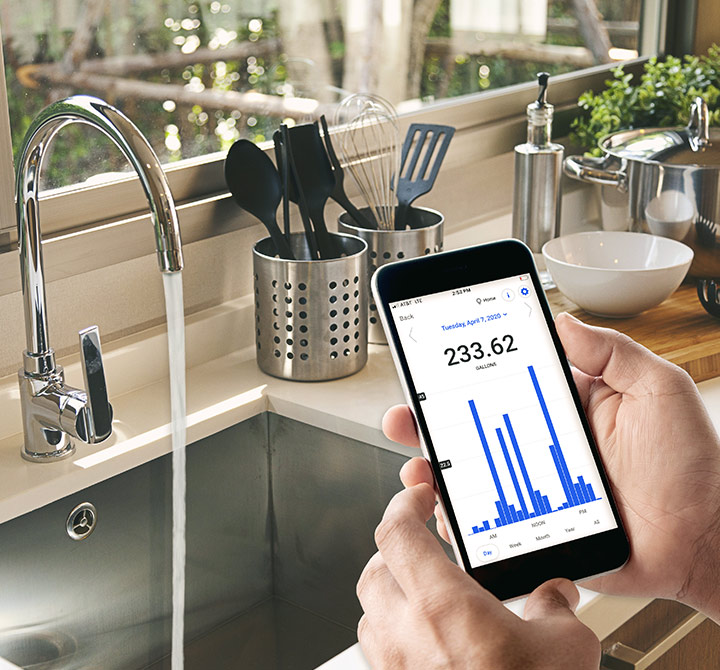 Customer is viewing their water usage on a mobile phone with connectivity provided by AT&T NetBond for Cloud and AT&T LTE-M.