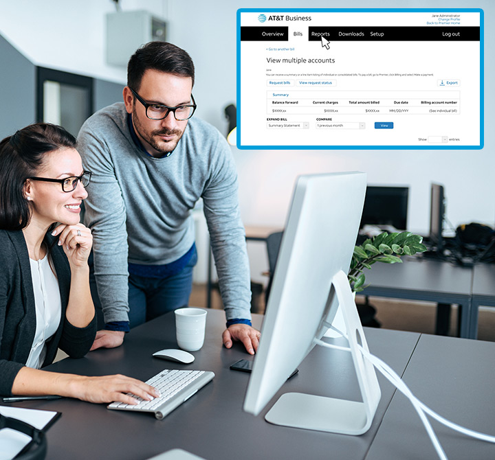 Man and woman managing their premier account on a computer