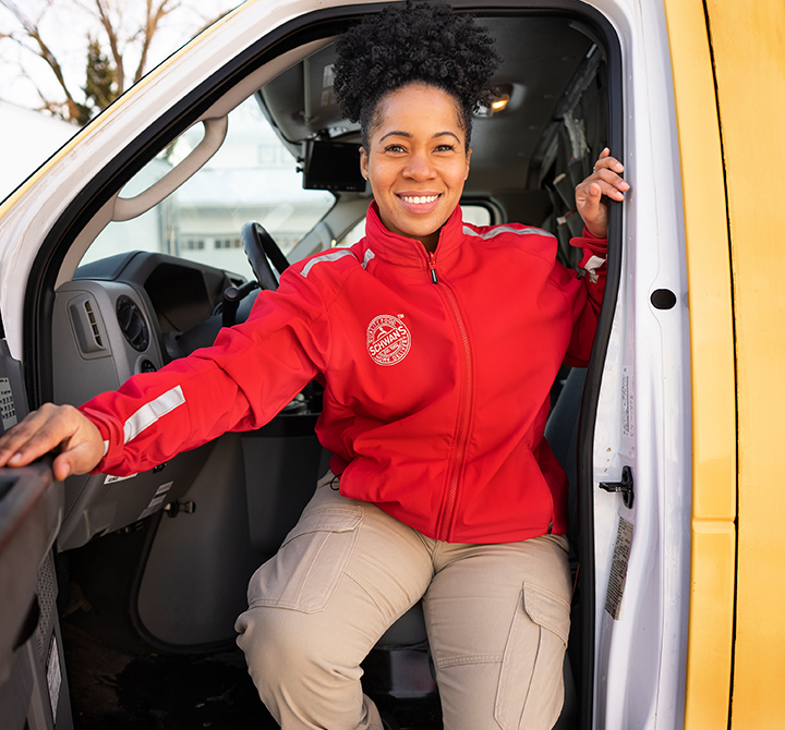 Schwan delivery driver getting out of a delivery van