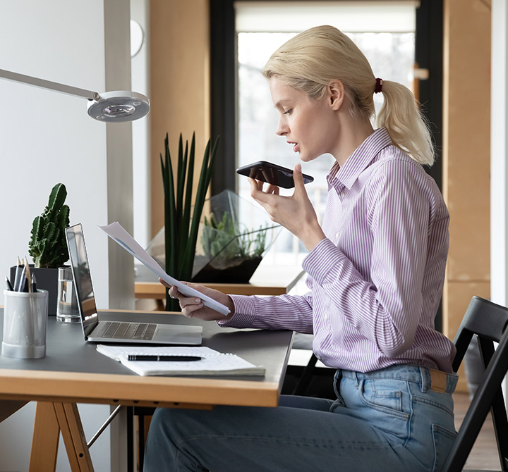 woman using smartphone voice technology