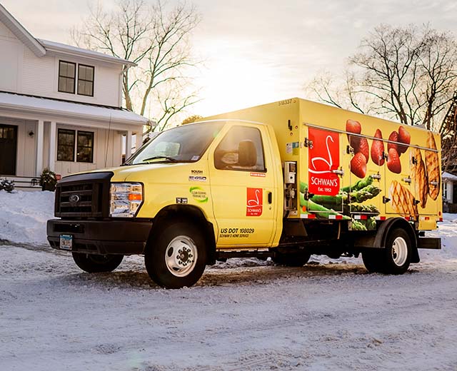 Schwan's delivery van in front of a residential home