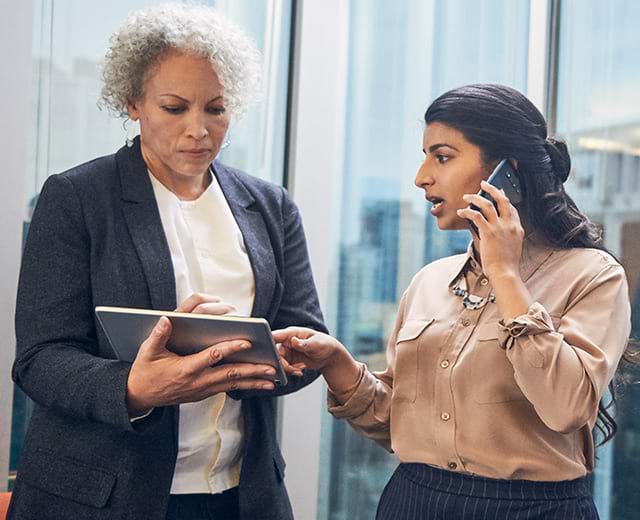 Women phone and tablet conference