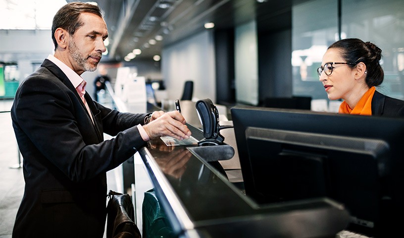 Guest at hotel check-in desk