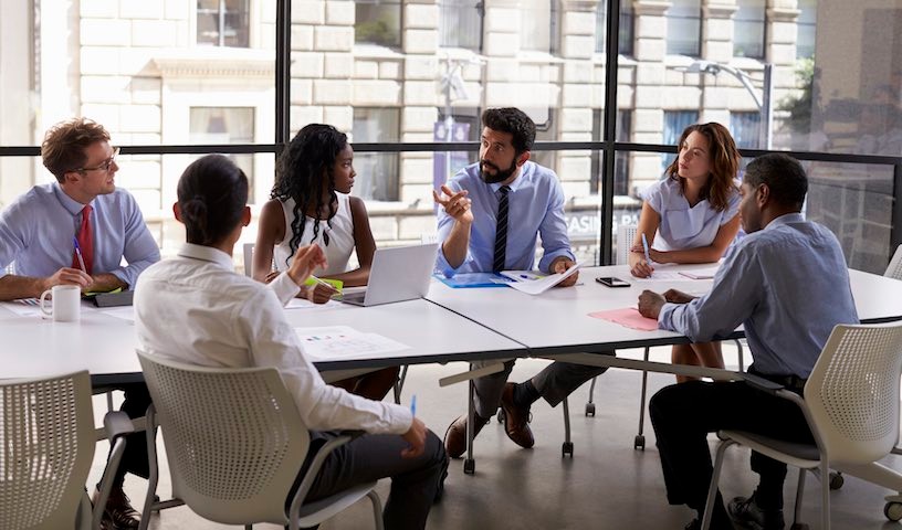 Corporate business team and manager in a meeting, close up