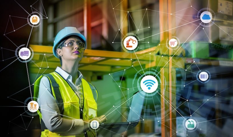 industry and Internet of Things concept. woman working in factory and wireless communication network. Industry4.0.