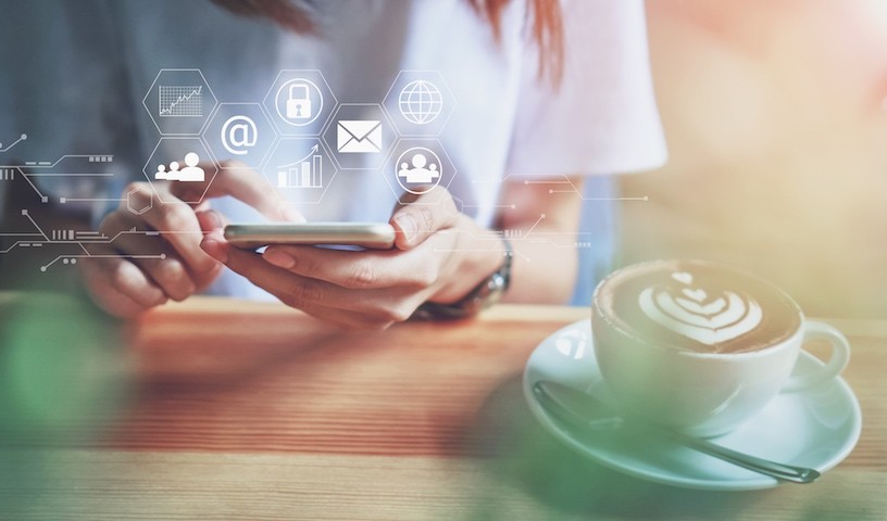 Women using a smartphone in the display and technology advances in stores.The concept of working anywhere with modern technology.