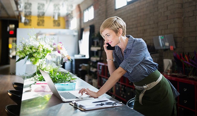 businesswoman on phone and laptop