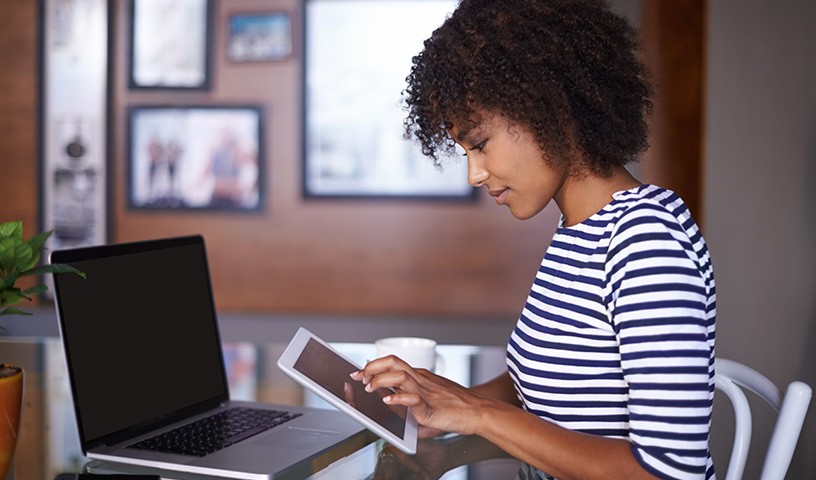 Professional on tablet and laptop