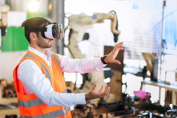 Employee being trained using VR goggles