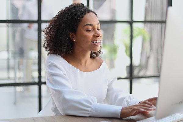 portrait young african american girl woman smiling office