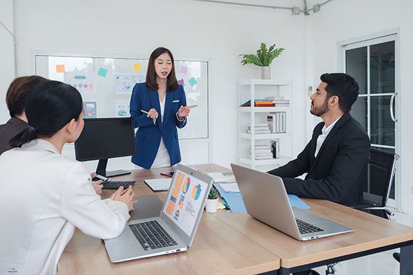 Portrait business team woman pretty girl and man handsome Asian group meeting sitting looking holding pen and looking creative write note plan ready for happy working online sale inside room office