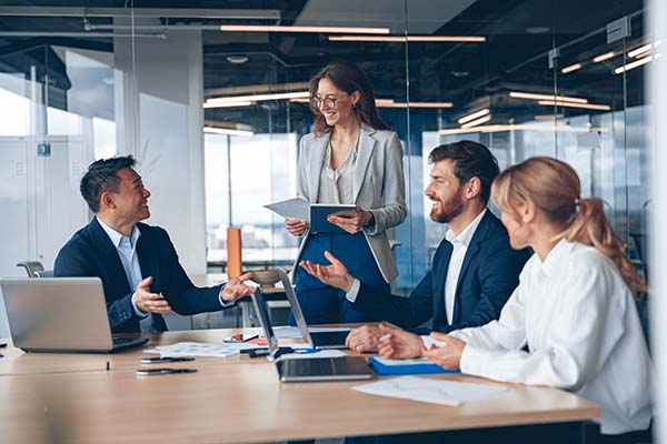 People at a table working in an office