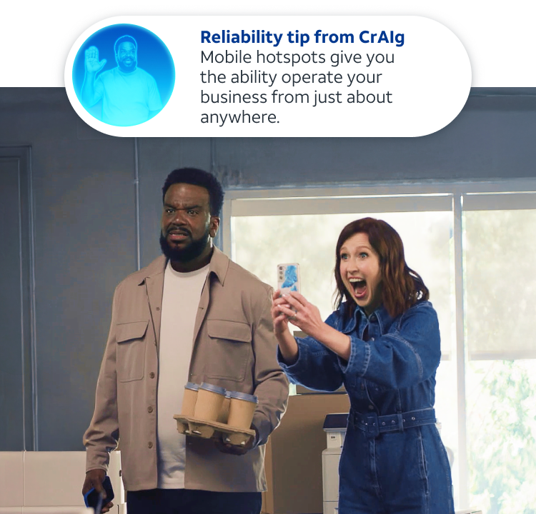 Craig playing keyboard in his workshop with security monitoring in the background