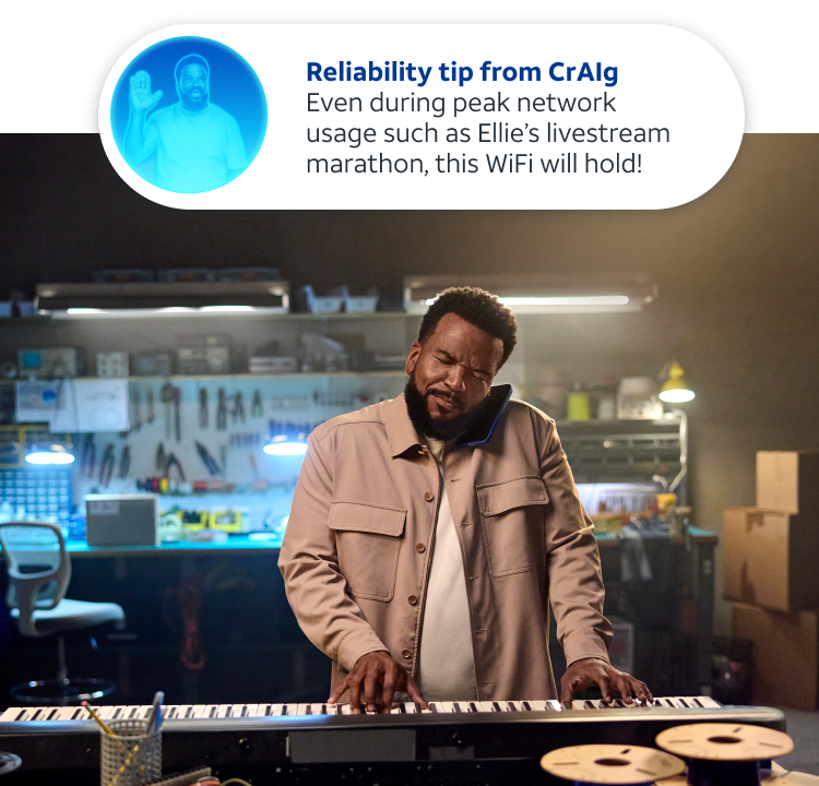 Craig at his desk with a basket of kittens, with a security alert showing on his laptop screen