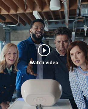 Wake Up with Craig Team (L-R:  Creed, Angela Craig, Oscar, Ellie) leaning down to look at the Wake Up with Craig Clock being viewed from behind the device.