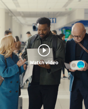 Set in an airport at a gate, an attendant greets the Wake Up with Craig Team (L-R: Oscar, Angela Craig, Creed, Ellie). Creed holds Wake Up With Craig Clock while Oscar, Angela and Ellie look at Craig as he looks at his laptop.